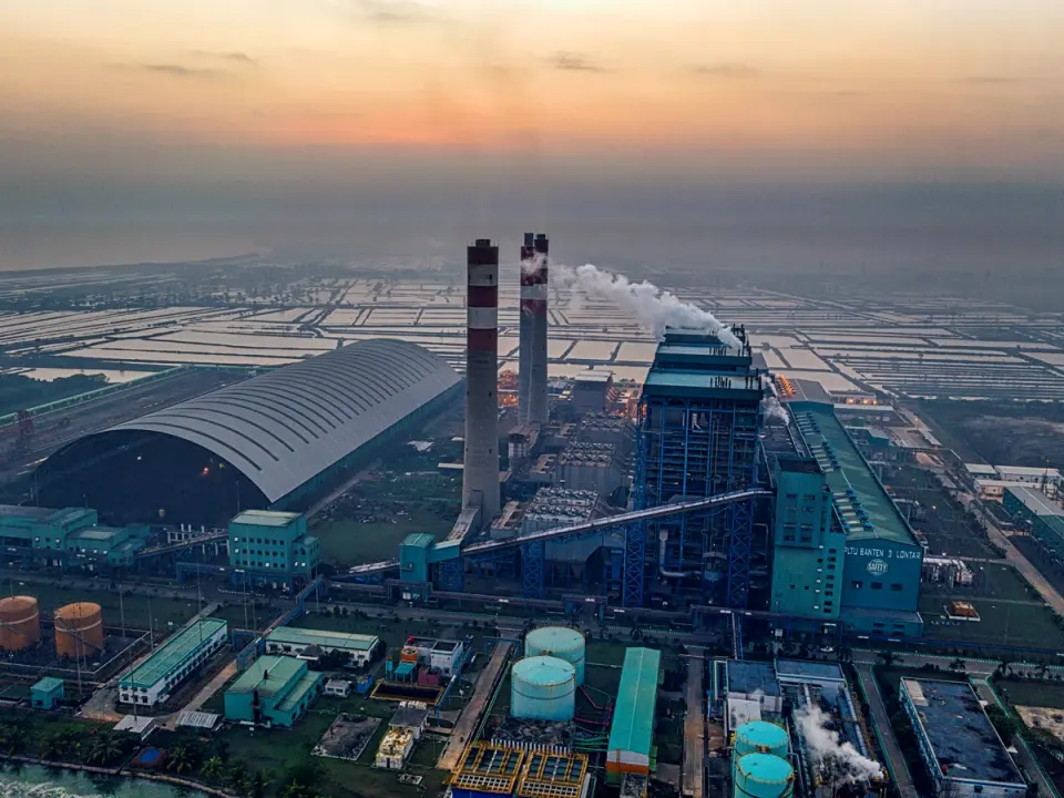 An industrial plant at dusk, seen from the air