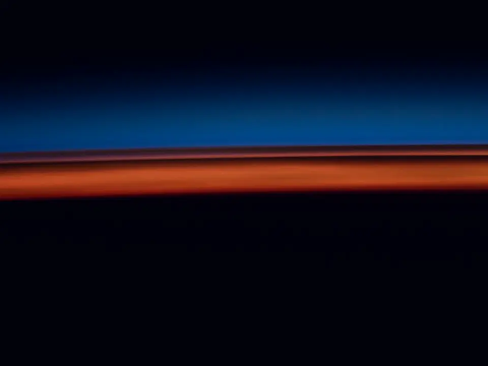 An orbital sunrise over the Earth, seen from the ISS